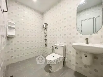 Spacious modern bathroom with sleek fixtures and minimalist design