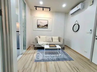 Modern living room with stylish decor and air conditioning