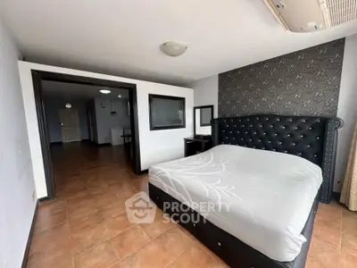Spacious bedroom with elegant bed and stylish decor in modern apartment