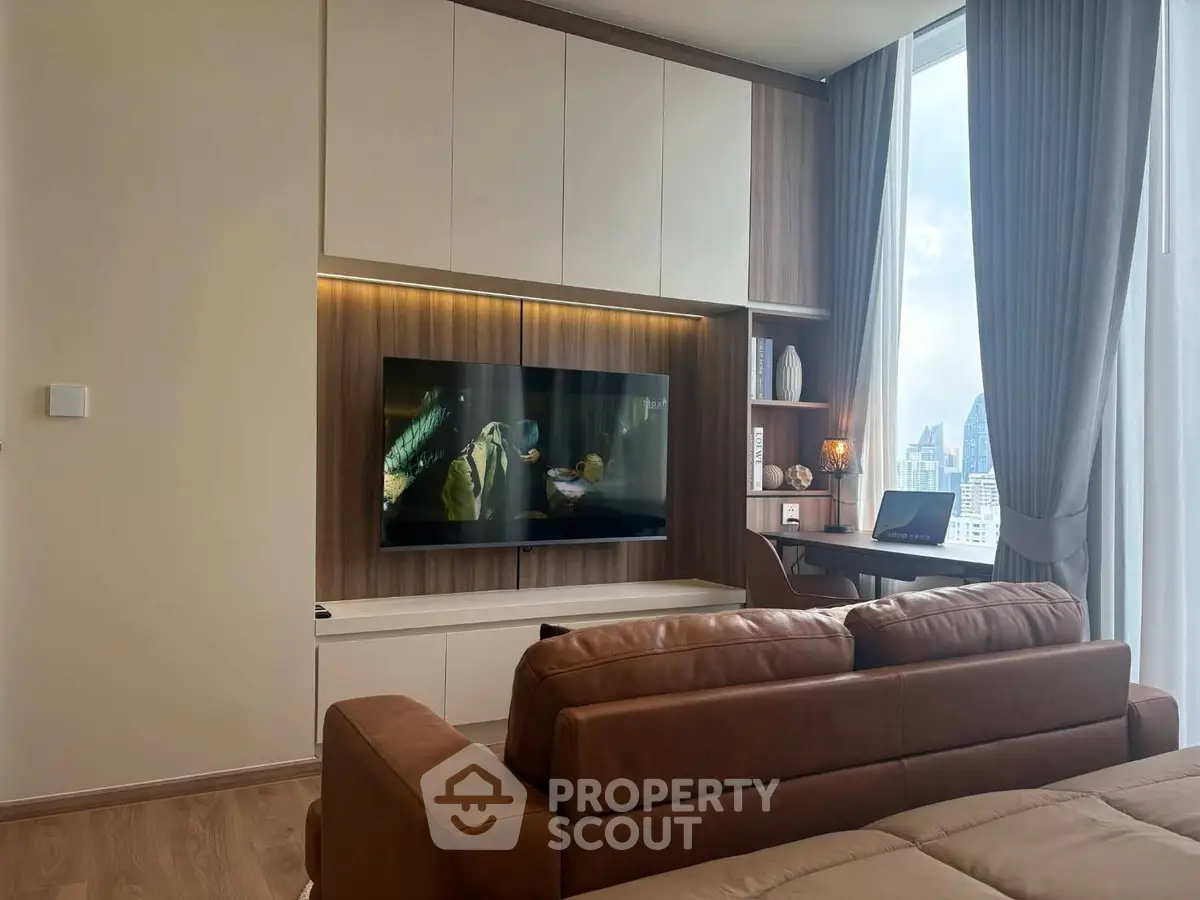 Modern living room with sleek design, large window, and city view