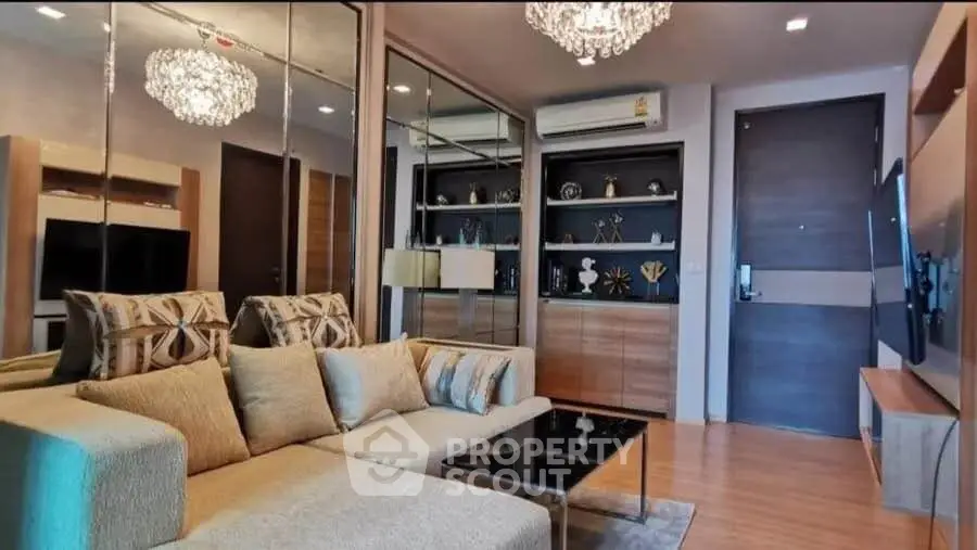 Luxurious living room with elegant decor and modern lighting in a stylish apartment.
