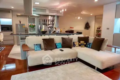 Spacious modern living room with open kitchen and stylish decor