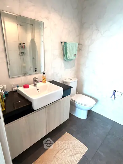 Modern bathroom with sleek fixtures and elegant marble tiles