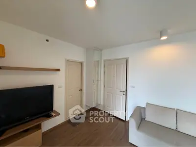 Modern living room with TV and cozy sofa in a minimalist apartment