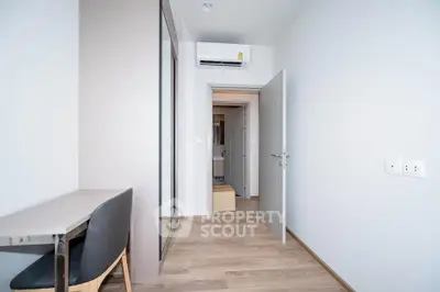 Modern minimalist bedroom with sleek design and air conditioning