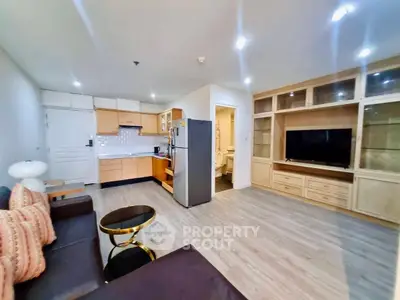 Spacious modern living room with open kitchen and stylish furnishings