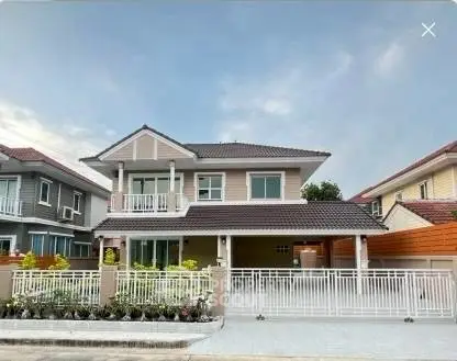 Charming two-story suburban house with a spacious front yard and modern design.