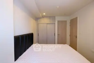 Cozy bedroom with modern design and ample storage space