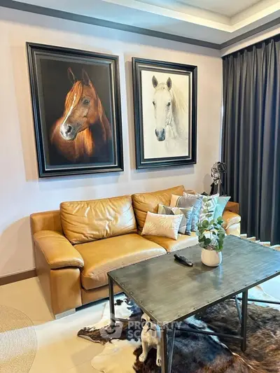 Stylish living room with leather sofa and horse paintings, perfect for modern home decor.