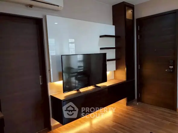 Modern living room with sleek TV unit and ambient lighting