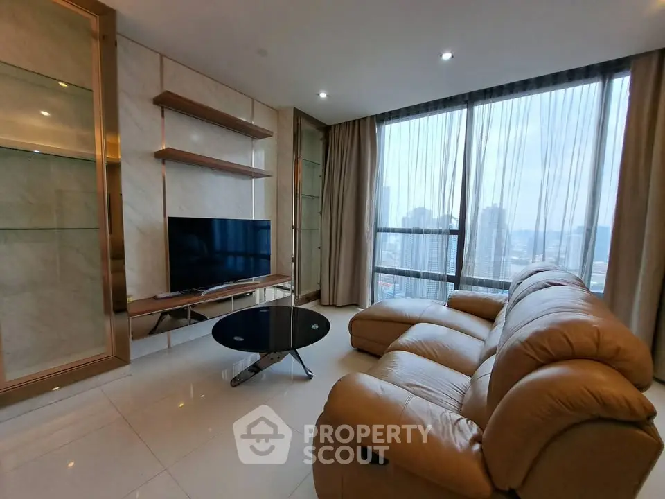 Luxurious living room with leather sofa and city view in high-rise apartment