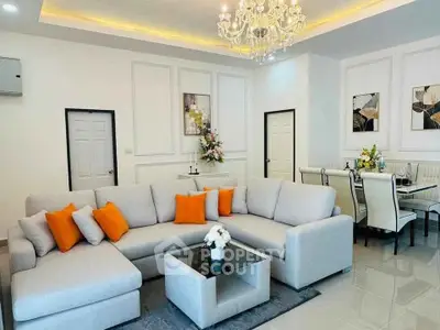 Luxurious living room with elegant chandelier and modern decor