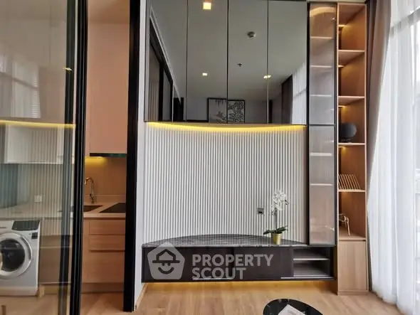 Modern apartment interior with sleek kitchen and washing machine