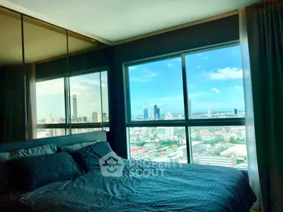 Luxurious bedroom with stunning city view from large windows in high-rise apartment.