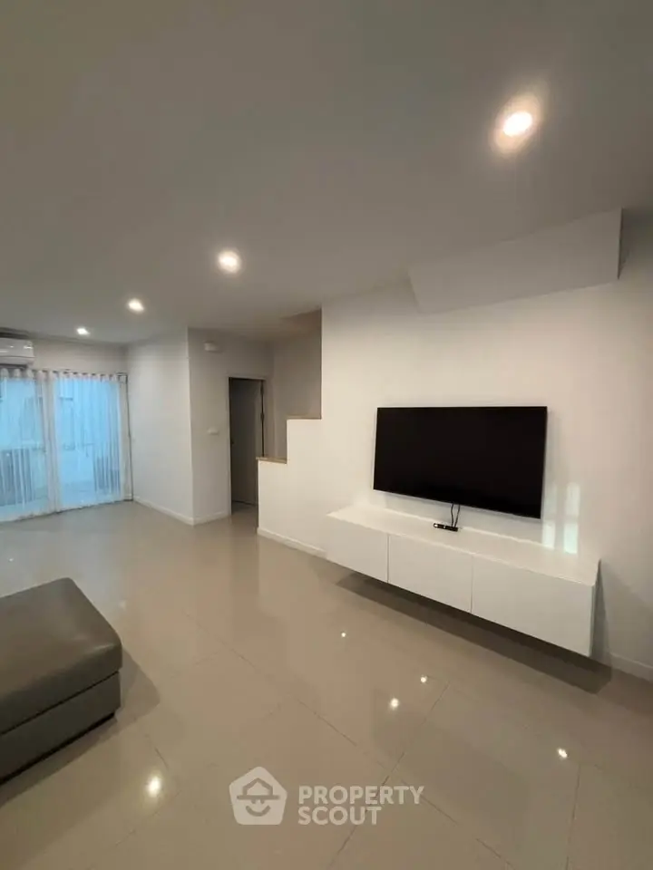 Modern living room with sleek TV setup and minimalist decor