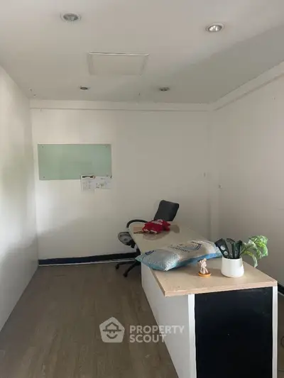 Minimalist office space with desk and chair, ideal for small business setup.