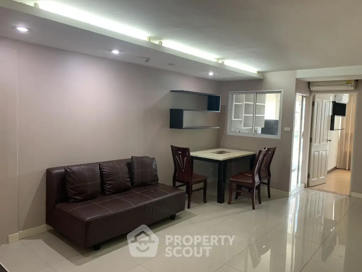Modern living room with sleek furniture and open layout, perfect for urban living.