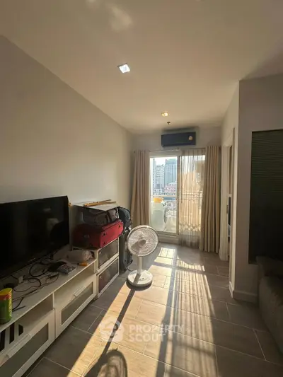 Modern living room with balcony view and natural light