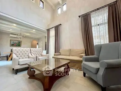 Elegant living room with high ceiling and stylish furniture