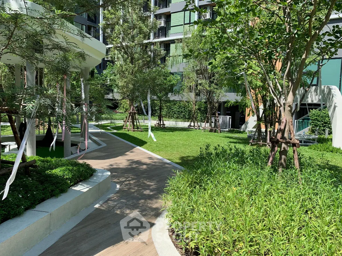 Lush garden area with modern landscaping in a residential complex