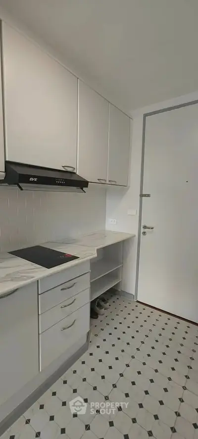 Modern kitchen with sleek cabinets and stylish flooring