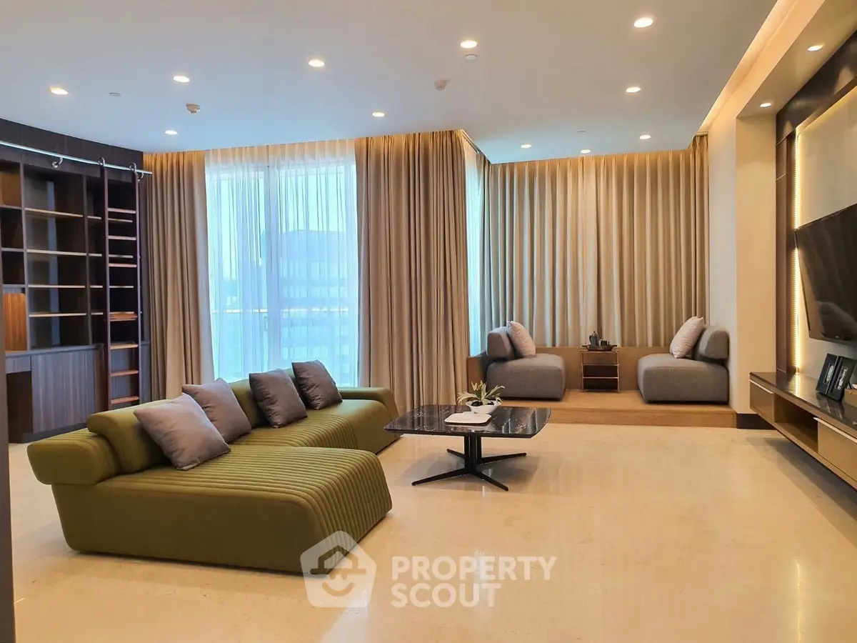 Luxurious modern living room with elegant furniture and floor-to-ceiling windows