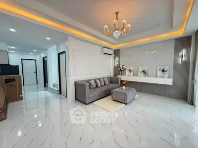 Luxurious living room with elegant chandelier and modern decor