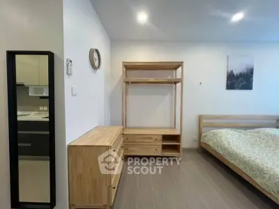 Modern bedroom with minimalist wooden furniture and cozy ambiance
