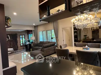 Luxurious open-plan living room with elegant dining area and modern decor