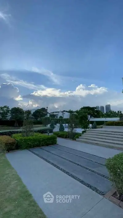 Stunning garden view with modern landscaping and clear blue sky.