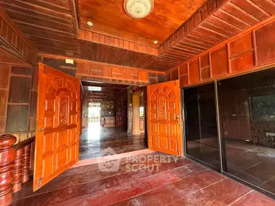 Stunning wooden interior with open double doors and polished floors