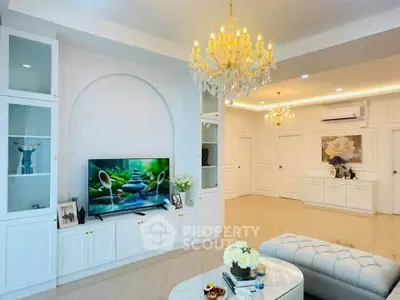 Luxurious living room with elegant chandeliers and modern decor