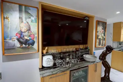 Stylish living room with modern entertainment center and unique art pieces