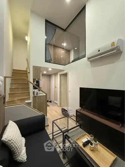 Modern duplex living room with high ceiling and stylish decor
