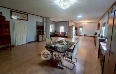 Spacious open-plan living and dining area with elegant decor and natural light.