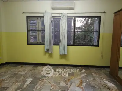 Spacious room with large windows and tiled floor, perfect for customization.