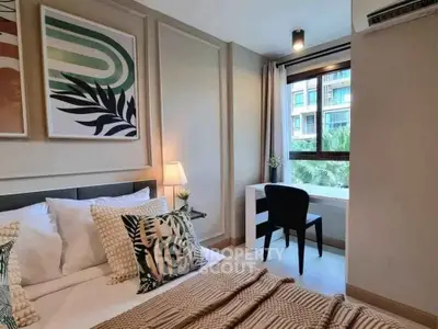 Stylish bedroom with modern decor and large window offering a scenic view, perfect for relaxation.
