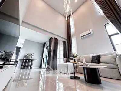 Luxurious modern living room with high ceilings and elegant decor