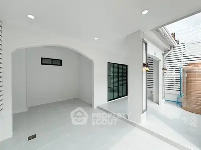 Modern white exterior with sleek design and ample natural light.