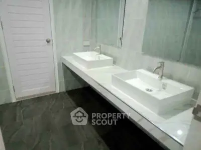Modern bathroom with dual sinks and sleek design