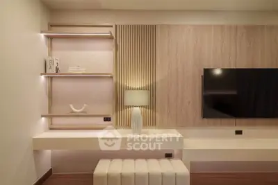 Modern living room with stylish wooden paneling and sleek TV setup