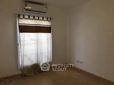 Spacious empty room with air conditioning and natural light