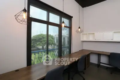 Modern study room with large window and stylish lighting