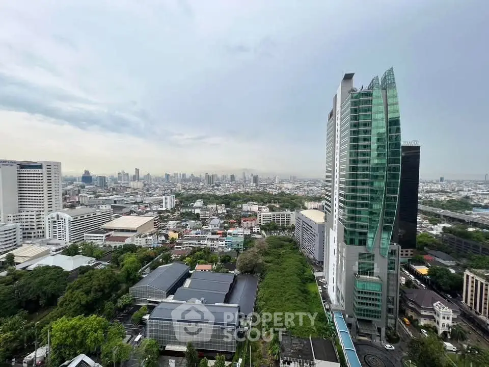 Stunning cityscape view showcasing modern high-rise buildings and lush greenery, perfect for urban living.