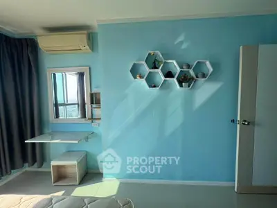 Bright bedroom with modern hexagonal shelves and air conditioning, featuring a small desk by the window.