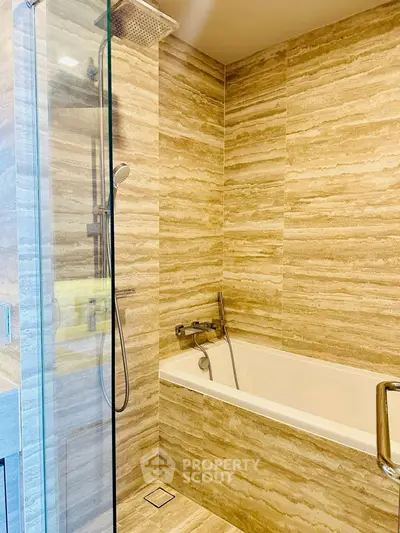 Luxurious bathroom with elegant stone tiles and modern fixtures