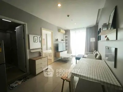 Modern apartment interior with open living and dining area, featuring stylish decor and natural light.