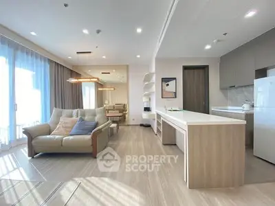 Spacious modern living room with open kitchen and elegant decor