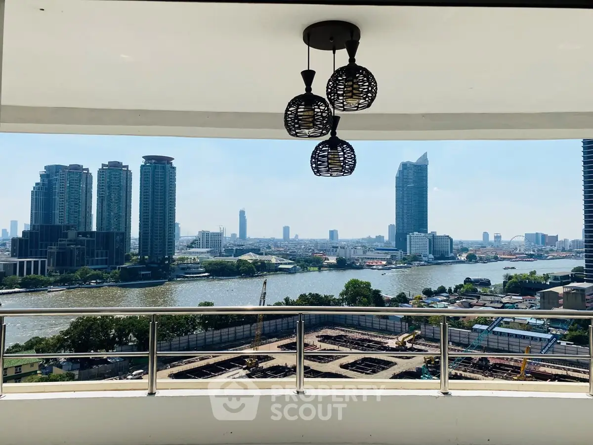 Stunning cityscape view from a modern balcony overlooking a river and skyline.