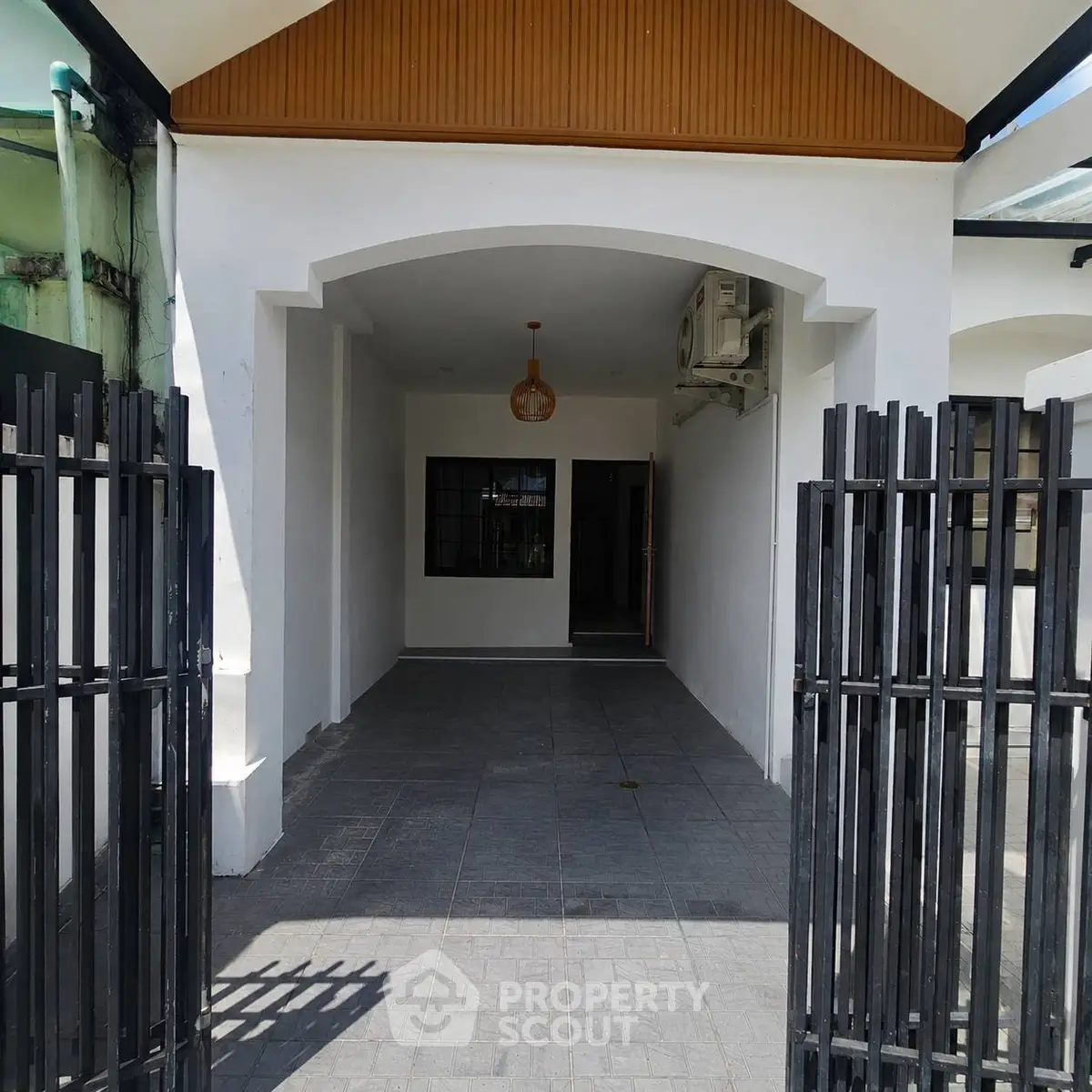 Charming entrance with modern design and gated entryway, perfect for welcoming guests.